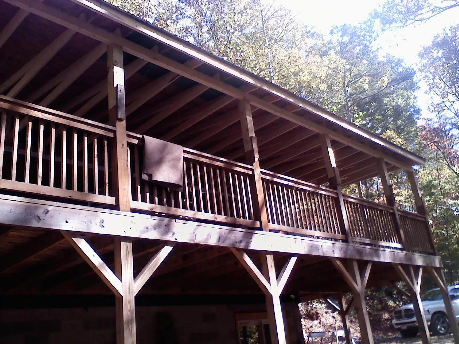 Timber framing under a new elevated porch and deck — Roof Leak Repair in North Yarmouth by Roofing Brothers